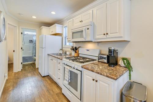 a kitchen with white cabinets and a white refrigerator at Less Than 1 Mi to Lake Norman Marina Home with Pool Access in Terrell