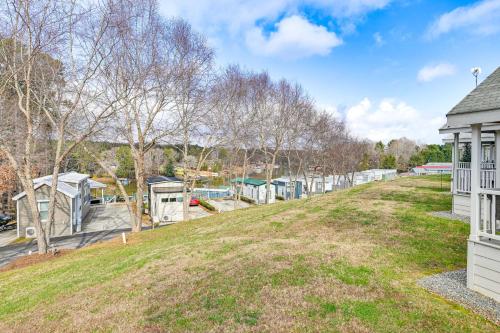 an empty yard next to a white house at Less Than 1 Mi to Lake Norman Marina Home with Pool Access in Terrell