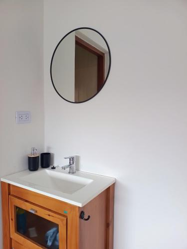 a bathroom sink with a mirror on the wall at Los 4 Vientos, Casa del Valle in San Javier