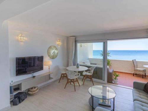 a living room with a view of the ocean at Bliss Luz Horizon - Panoramic Sea View - 50m to Beach - Central Praia da Luz - Walk distance to Everywhere in Luz