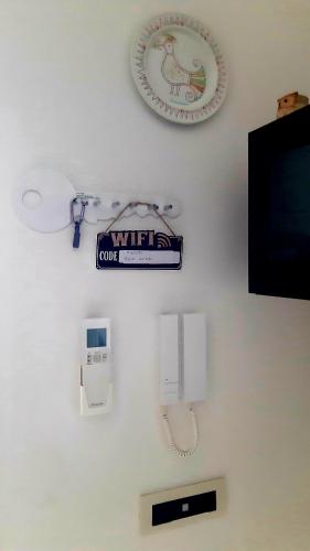a white wall with a wiiuanauanauanauanauanauanauanauanauana at P I G Ó 's HOUSE in Budoni