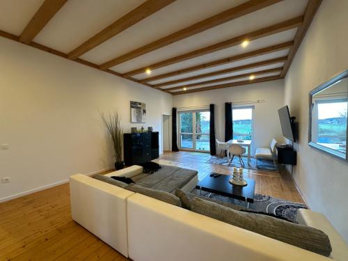 a living room with a couch and a tv at Indigo Sol in Ursensollen