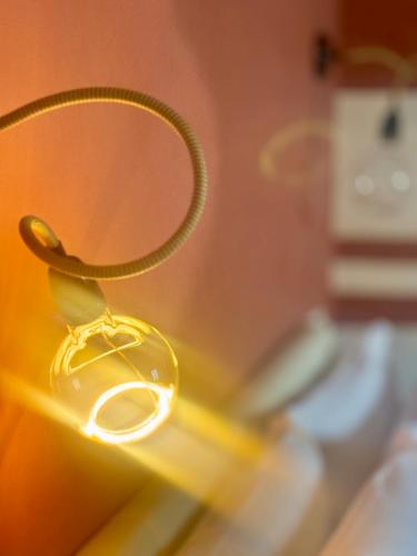 a close up of a light on top of a table at HABITARE Lecce & Salento in Lecce