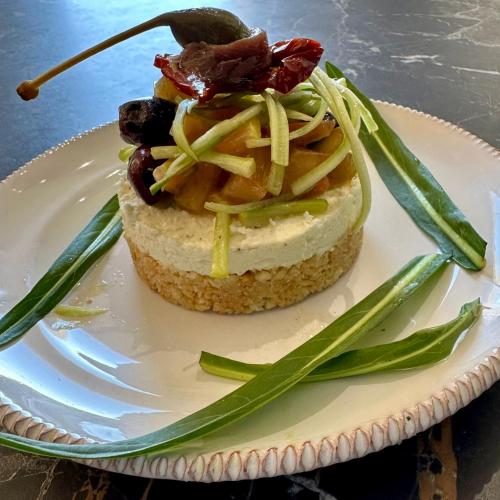 a piece of food on a white plate at HABITARE Lecce & Salento in Lecce