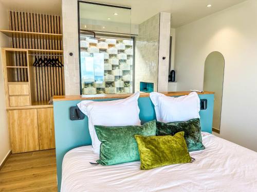 Ein Bett oder Betten in einem Zimmer der Unterkunft Baie du Paradis