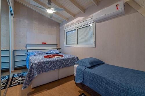 Ένα ή περισσότερα κρεβάτια σε δωμάτιο στο Pertinho da Catedral - stayhousetemporada