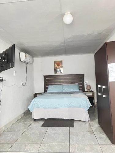Postel nebo postele na pokoji v ubytování Exodus Guesthouse