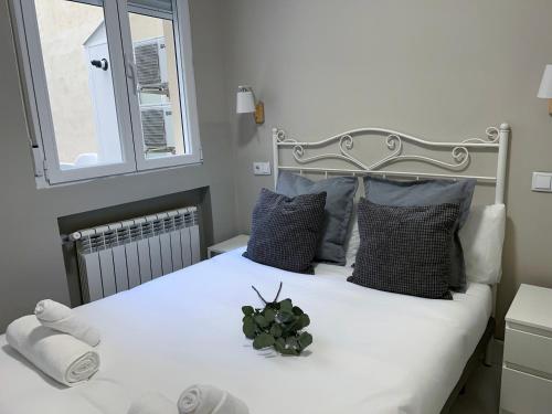 Ένα ή περισσότερα κρεβάτια σε δωμάτιο στο Plaza España Centro - Apartamento para 8 personas