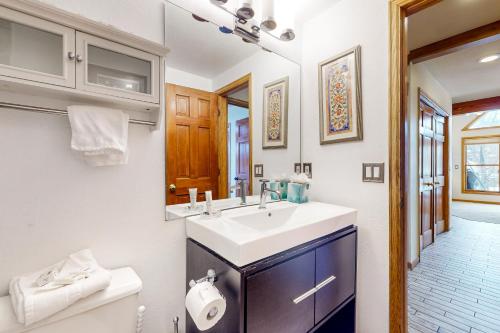 a bathroom with a sink and a mirror at Silver Jacks Condo in Breckenridge