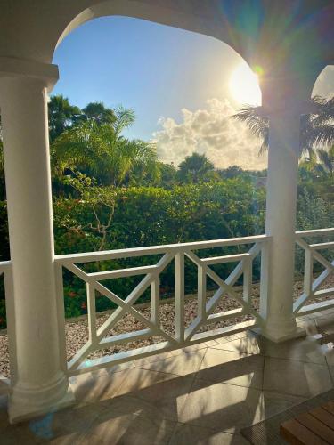a view from the porch of a house with the sunset at Abondante Paradise in Jan Thiel
