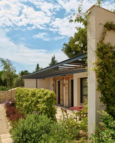 a house with a garden in front of it at LA BASTIDE DES CULS-ROUSSET in Marseille