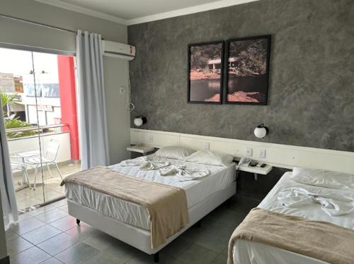 Postel nebo postele na pokoji v ubytování RADAR PÁLACE HOTEL
