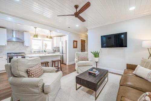a living room with a couch and a table at The Bogard Only 4 Blocks to King in Charleston