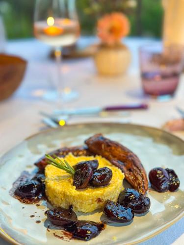 a plate of food with sausage and other foods at LA BASTIDE DES CULS-ROUSSET in Marseille
