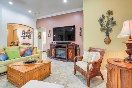 a living room with a couch and a table at Near Parks Port St Lucie Home with Private Pool! in Port Saint Lucie