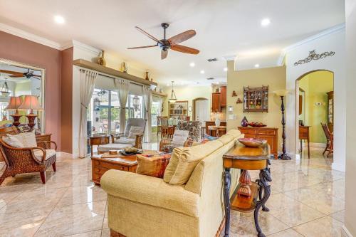 a living room with a couch and a table at Near Parks Port St Lucie Home with Private Pool! in Port Saint Lucie