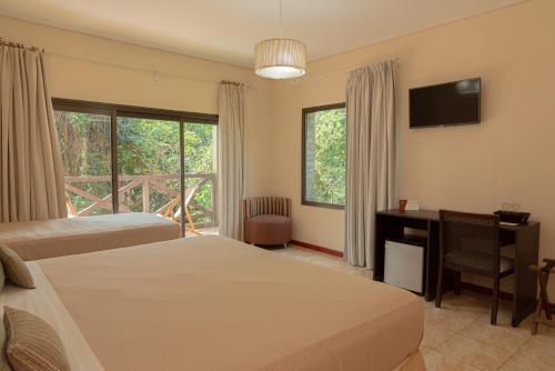 Letto o letti in una camera di Village Cataratas