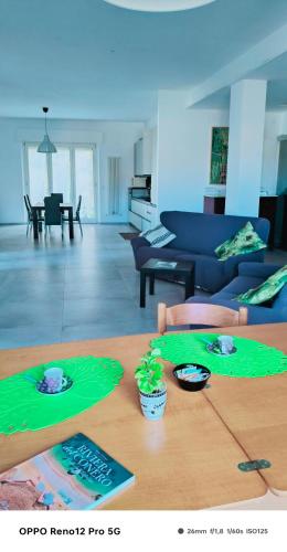 a living room with a table and a couch at Affittacamere Roberta in Osimo