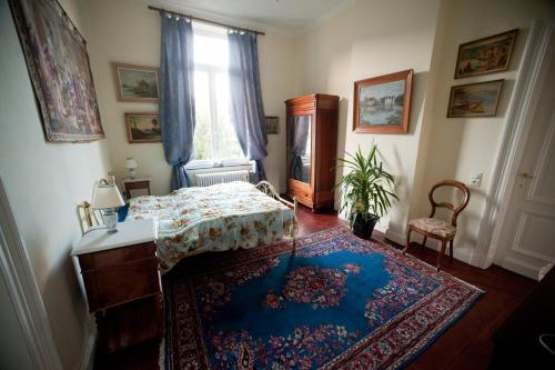 Postel nebo postele na pokoji v ubytování Chateau Neufays