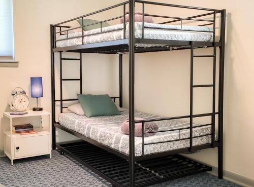 a bedroom with two bunk beds in a room at Relax Near Chattanooga at cozy Magdelaine House in Fort Oglethorpe