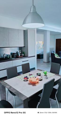 a kitchen with a table with food on it at Affittacamere Roberta in Osimo