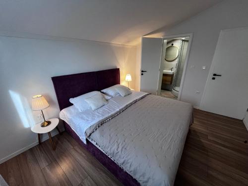 Ένα ή περισσότερα κρεβάτια σε δωμάτιο στο Apartman Barbara