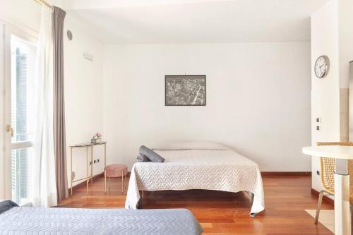 Letto o letti in una camera di Il Vicolo In Centro