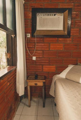 Ένα ή περισσότερα κρεβάτια σε δωμάτιο στο A Ilha Verde Hotel Pousada na Praia