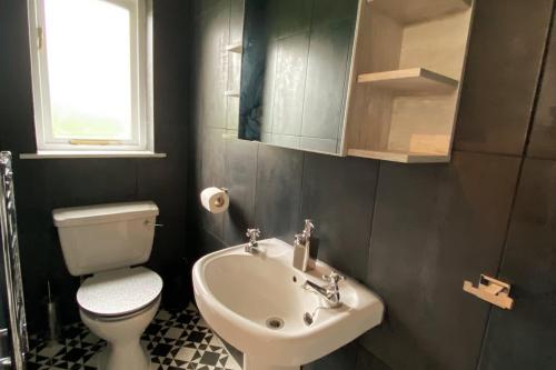 O baie la Breach Barn, a very bright spacious home from home