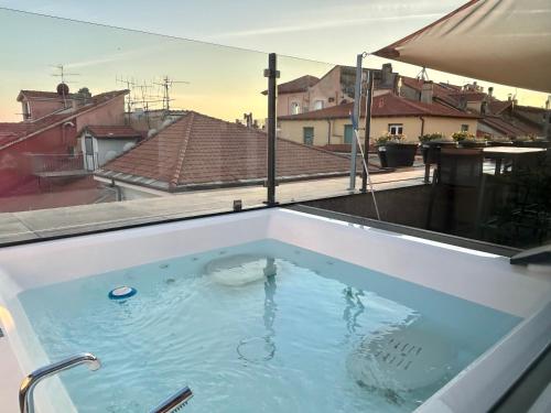 a hot tub on top of a roof at Doria House in Imperia