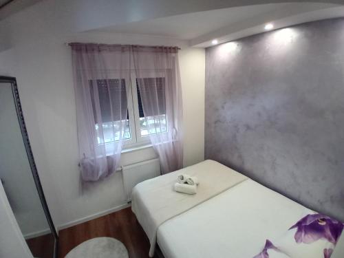 Postel nebo postele na pokoji v ubytování Apartman Milan'o