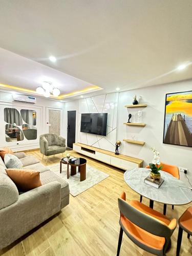 a living room with a couch and a table at Lush Cove Apartments in Lekki