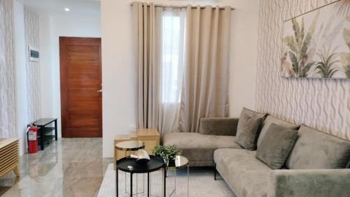 a living room with a couch and a table at Mactan Reihenhaeuser in Lapu Lapu City