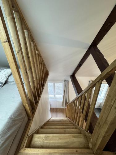 a staircase leading up to a bed in a room at Mezza Summer 3ème Étage in Abbeville