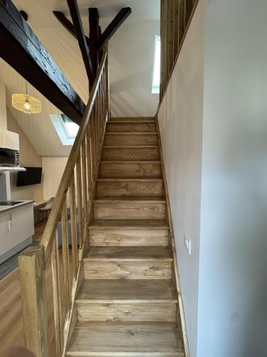 a staircase in a house with wooden floors at Mezza Summer 3ème Étage in Abbeville