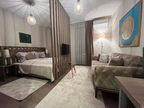 Postel nebo postele na pokoji v ubytování Apartmani SOVA