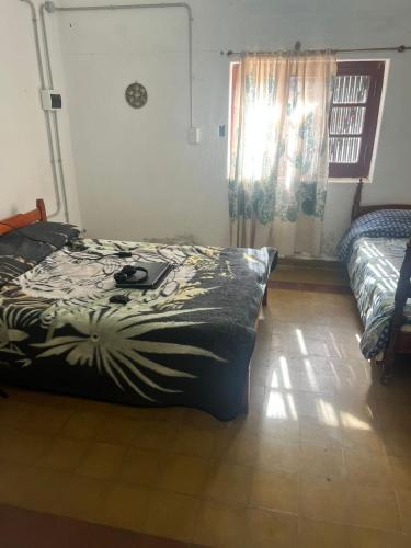 Giường trong phòng chung tại Bendecida Depto