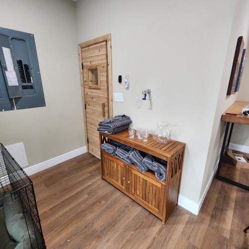 a room with a wooden table with glasses on it at Altitude Adjustment in Nellysford