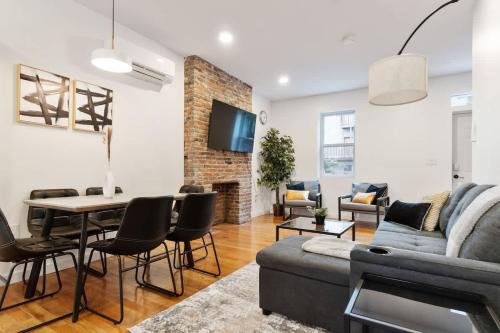 a living room with a couch and a table at 3 BDRM 2 and a Half Bath - House Private Yard Duplex in Pittsburgh