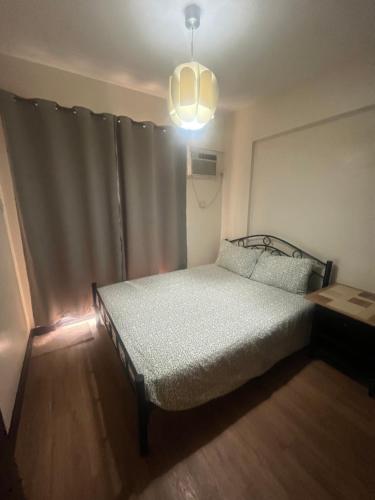 Ένα ή περισσότερα κρεβάτια σε δωμάτιο στο Arista Place Condo 2 bedroom unit