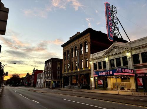 an empty street in a small town with buildings at Pet Friendly 3 Bdrm House with Private Yard in Pittsburgh