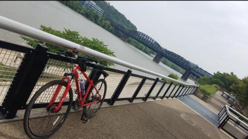 a bike parked next to a rail on a bridge at Pet Friendly 3 Bdrm House with Private Yard in Pittsburgh