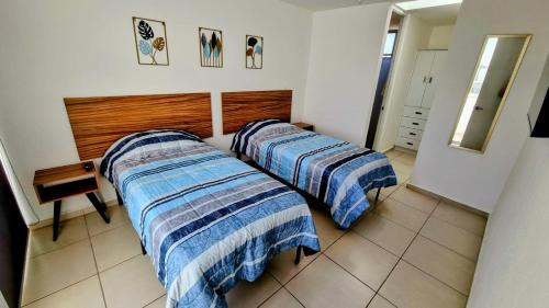 Jesús MaríaにあるHogar Augustaの部屋に2つのベッドがある