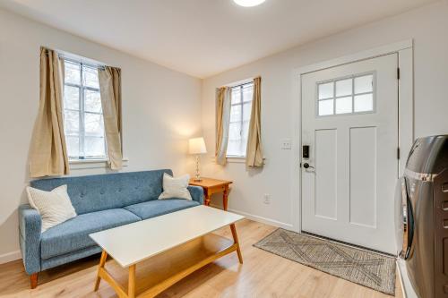 a living room with a blue couch and a table at Studio Apartment Near East Atlanta Village in Atlanta