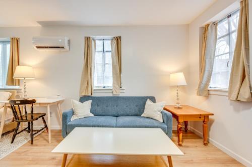 a living room with a blue couch and a table at Studio Apartment Near East Atlanta Village in Atlanta