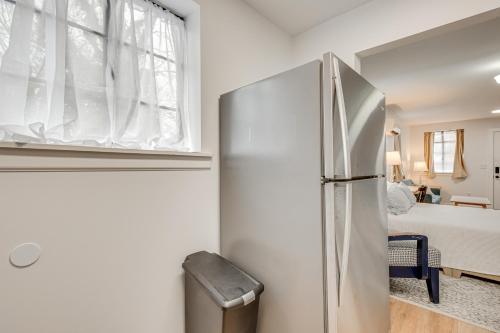 a refrigerator in a kitchen with a bedroom at Studio Apartment Near East Atlanta Village in Atlanta