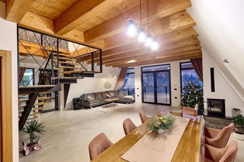 a large dining room with a table and chairs at Cabana Ana in Borşa
