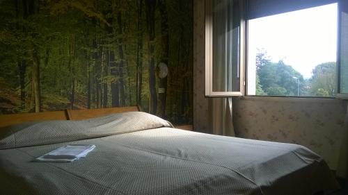 Кровать или кровати в номере Da Beppe