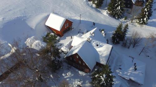 an aerial view of a house covered in snow at Bedřichovská Devítka in Bedřichov