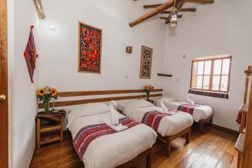 Llit o llits en una habitació de Hostal El Grial